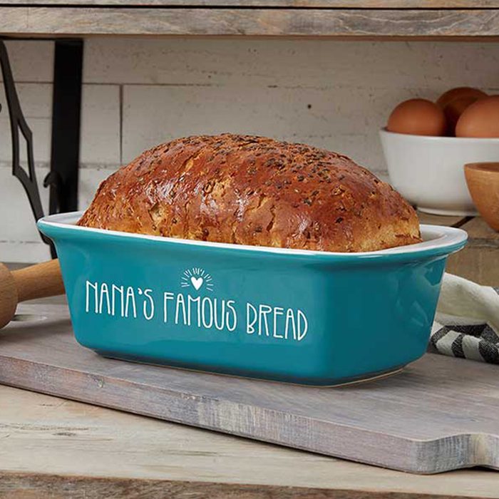 Bread rests in a teal baking dish labeled 
