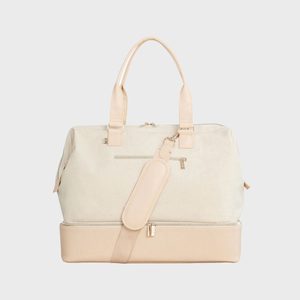 A beige travel bag with tan handles and shoulder strap; features a front pocket and bottom compartment, set against a plain background.