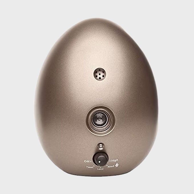 Egg-shaped device with button and speakers, stands against a plain background. Text: â€œOff-Test-Low-Med-High.â€