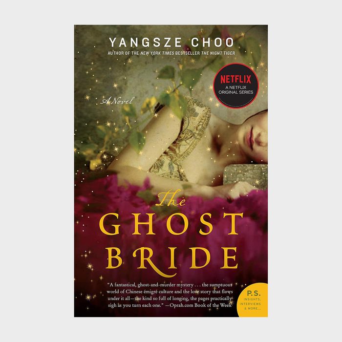 Book cover features a woman lying among leaves and pink fabric. Title: 
