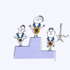Three cartoon figures stand on a podium with medals in a stylized Paris backdrop featuring the Eiffel Tower.
