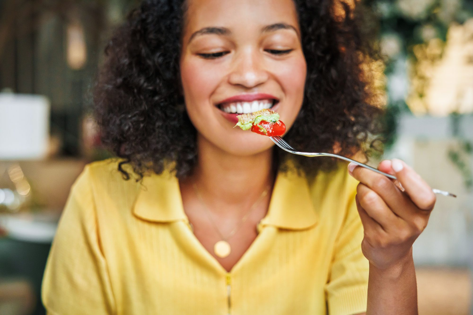 A Joyful Woman Is About To Enjoy A Bite Of A Fresh And Appetizing Salad