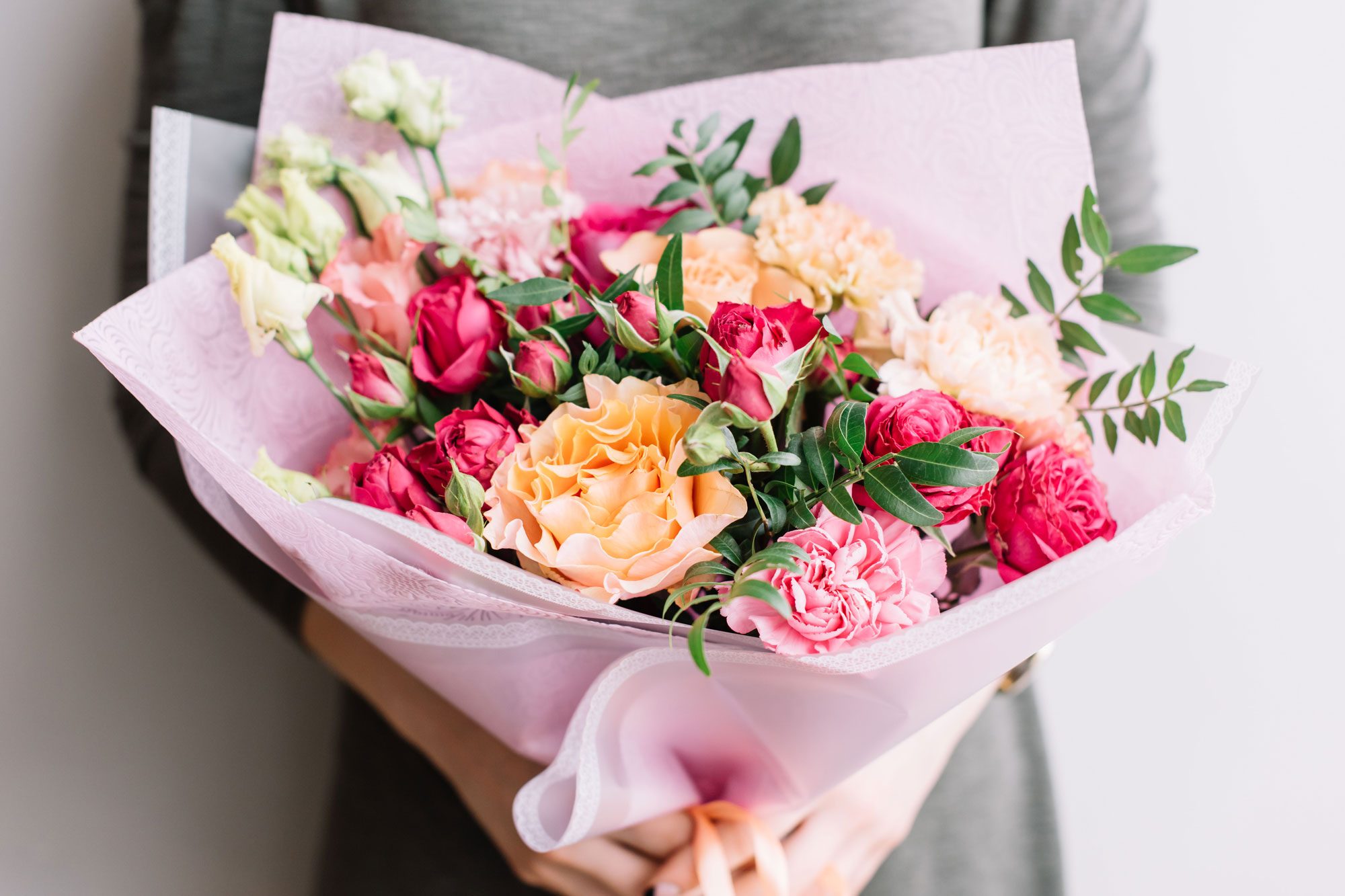 Woman Holding A Colourful Fresh Blossoming Flower Bouquet Of Different Sorts Of Flowers