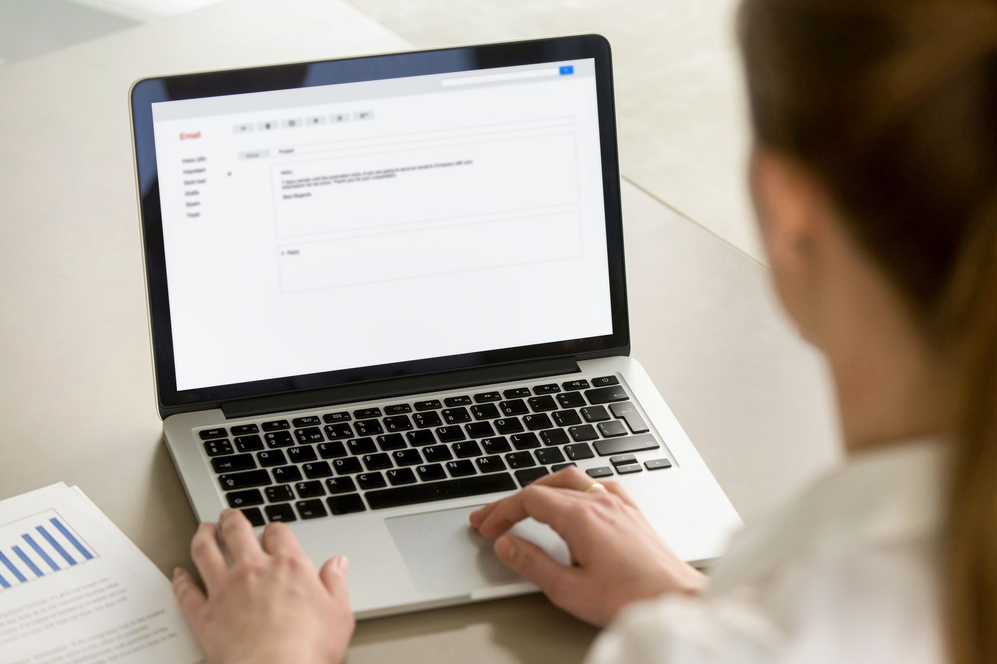 Woman Typing E Mail Using Laptop
