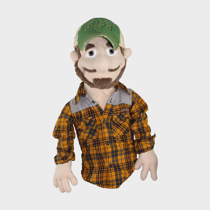 A puppet with a beard and mustache wears a green 