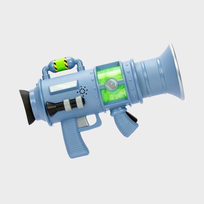 A blue toy ray gun with green chamber and handle, rests on a plain white background.