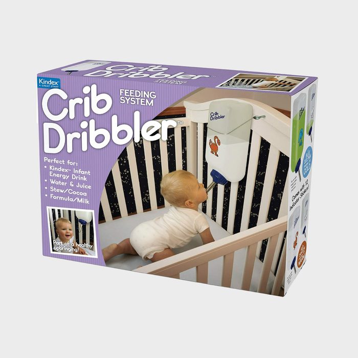 Box shows baby using a bottle-like feeding system attached to crib bars. Text reads: 