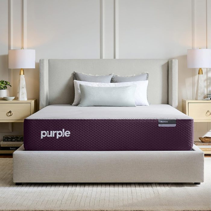 Bed with a gray headboard displays a 