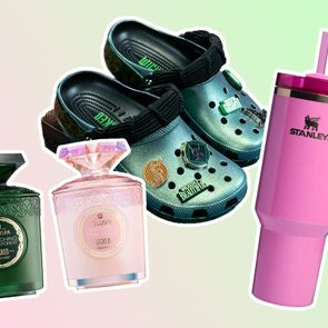 Shoes embellished with pins and perforated design float with green Voluspa candles and a pink Stanley mug against a pastel gradient background.