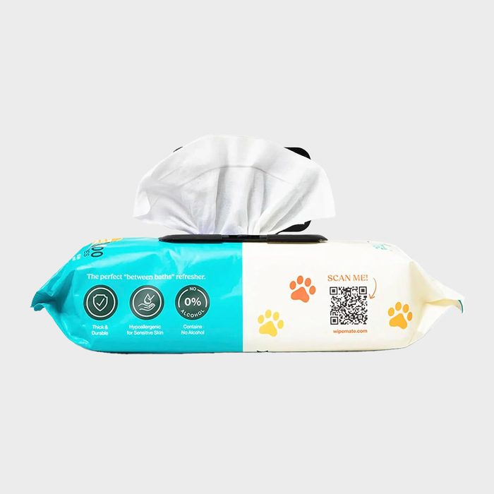 Package dispensing wipes; rests on a plain surface. Text reads: 