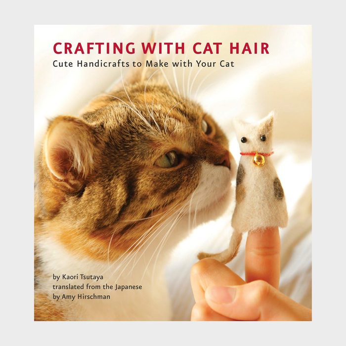 Book cover shows a cat nuzzling a small felt cat figure on a finger. Text: 