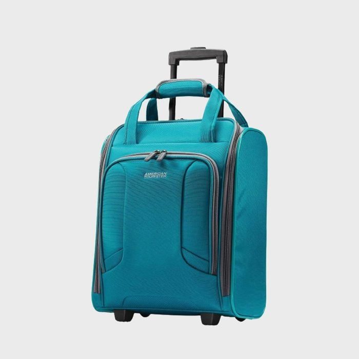 Teal rolling suitcase stands upright; handle extended in a plain, white background. Text reads â€œAmerican Touristerâ€ on the front.