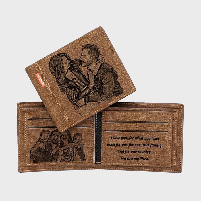 Leather wallet displays engraved couple and family portraits. Text inside reads: 