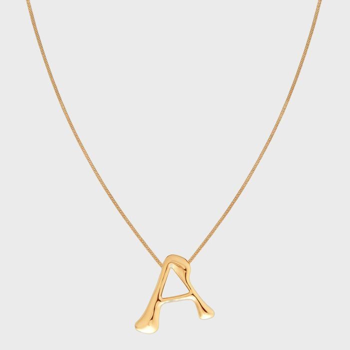 Gold necklace displays letter 
