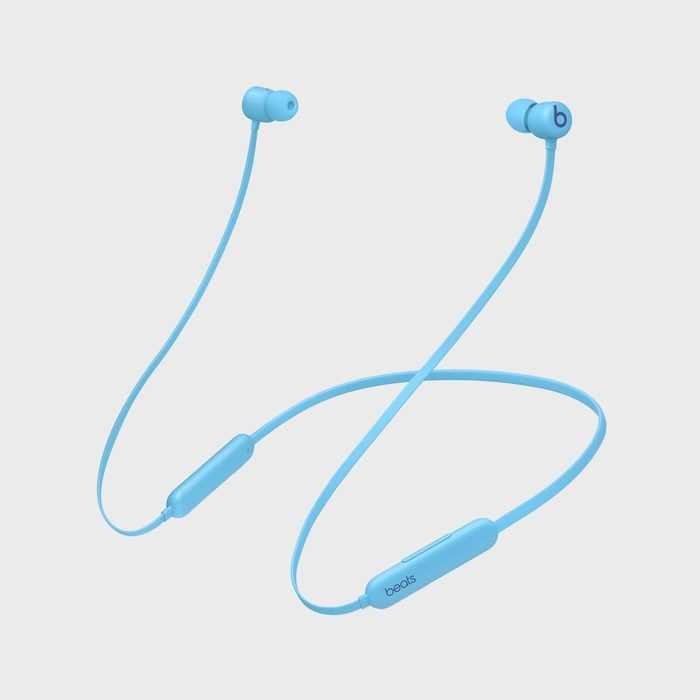 Blue wireless earphones rest in a stylish loop shape with 
