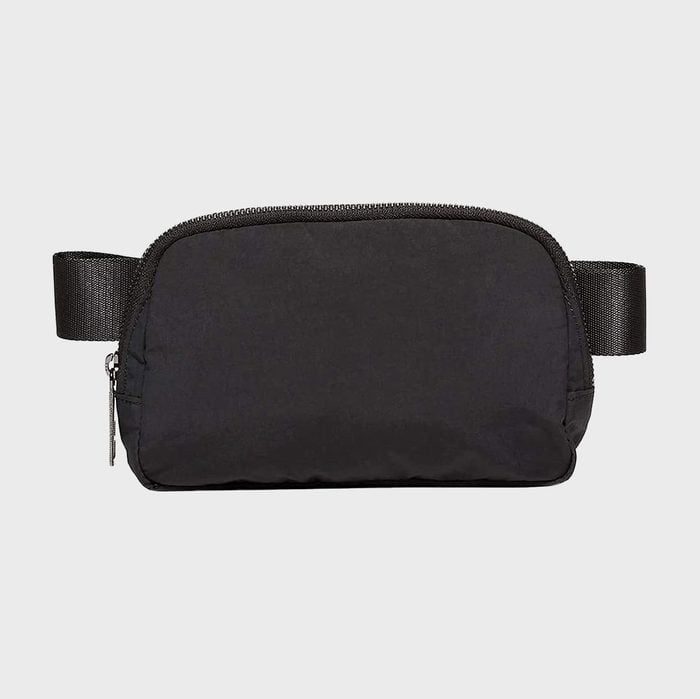 A black waist bag sits against a plain gray background, featuring a zipper at the top and adjustable straps on each side.
