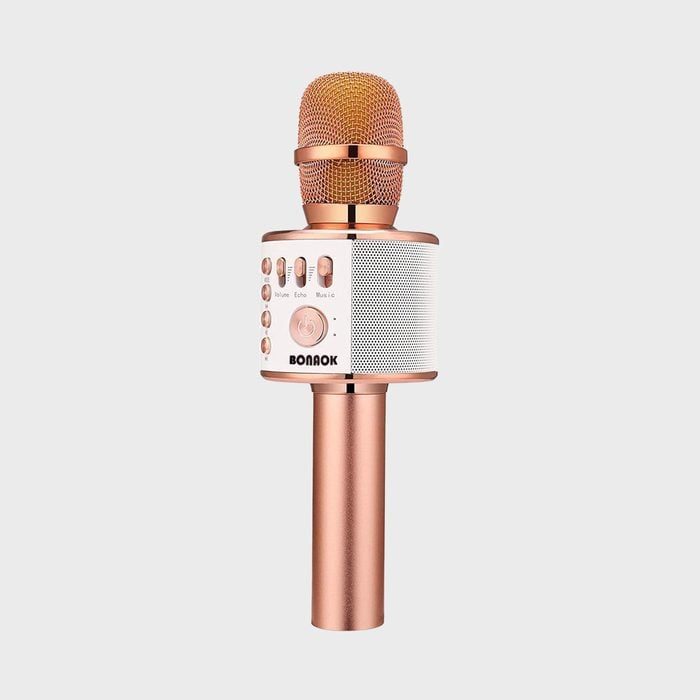 A rose gold karaoke microphone with control buttons, labeled 