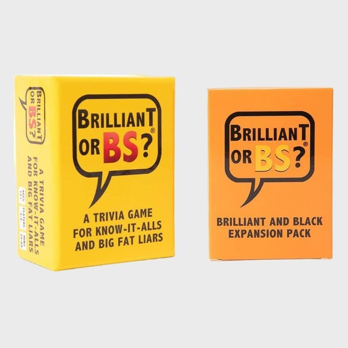Two card game boxes stand upright; yellow box reads, 