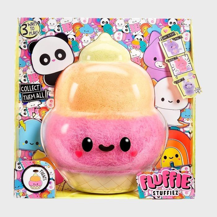 A plush ice cream toy smiles within colorful packaging displaying cute cartoon characters and text: 