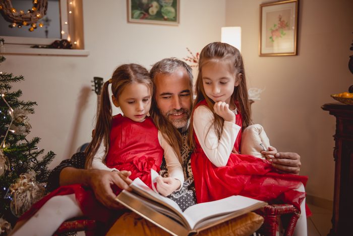 Father reading Fairy tales on Christmas