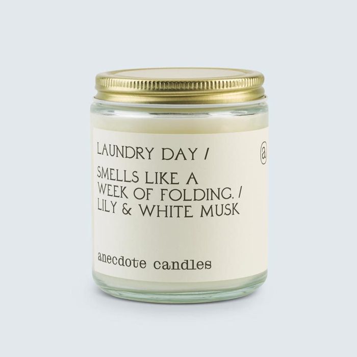 Candle in glass jar, labeled 