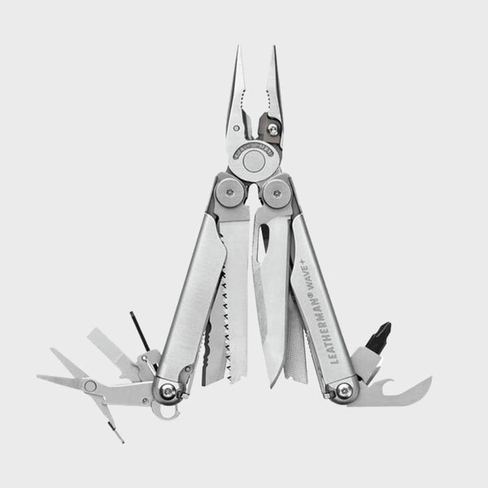 Multitool pliers unfold with various blades and tools extended, including scissors and screwdrivers, against a plain gray background. Text reads 