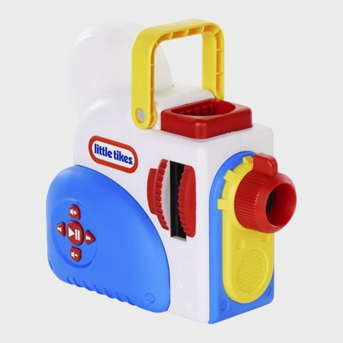 Toy projector sits idle with colorful buttons and a yellow handle, displayed against a plain background. Text reads: 