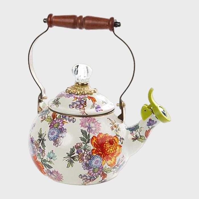 Teapot; features a floral pattern, transparent knob, and a wooden handle; set against a plain background.