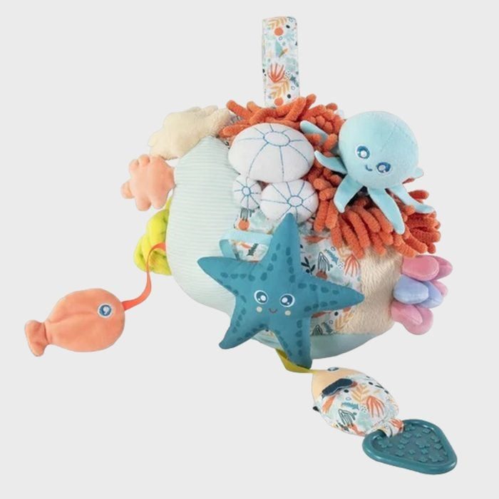 Plush toy with various sea creatures attached, including an octopus and starfish, displayed against a plain background.