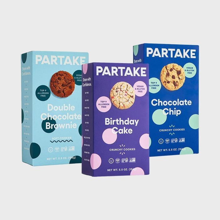 Three colorful cookie boxes stand upright, labeled 