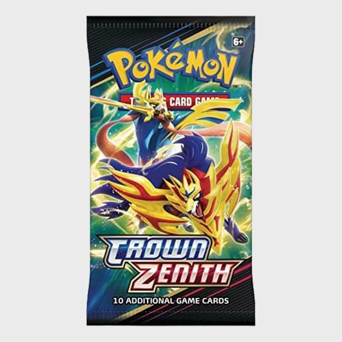 A PokÃ©mon card pack features a dynamic creature, adorned with red and yellow armor, set against an electrifying, colorful background. Text reads: 
