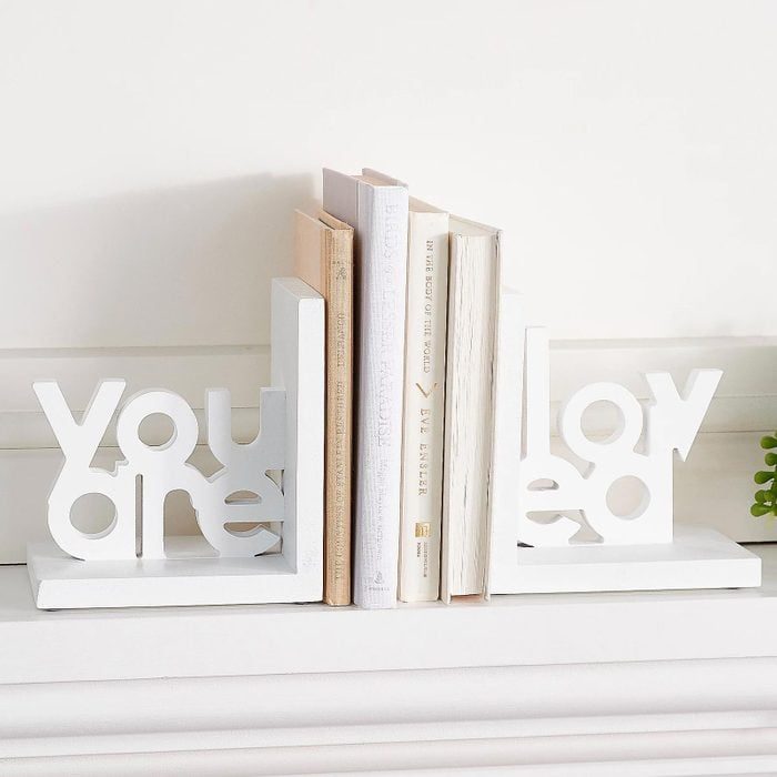 Bookends hold books upright on a shelf, with the text 