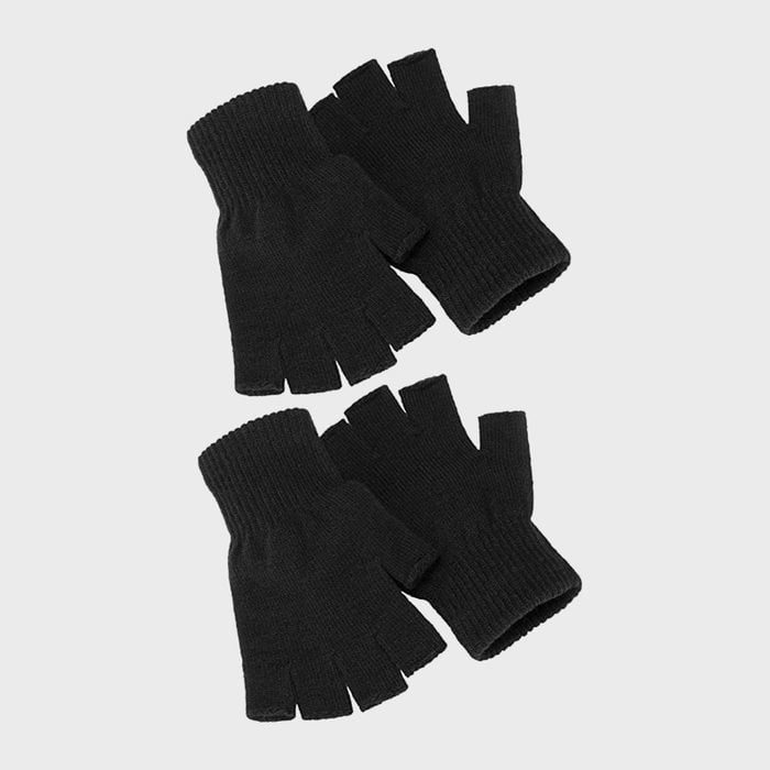 Fingerless black gloves lying on a plain light gray background.