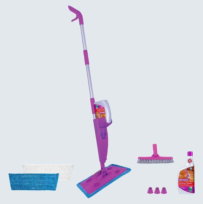 Mop with cleaning solution stand. Includes blue and white pads, brush, small accessories. Positioned against a plain background, showcasing cleaning accessories.