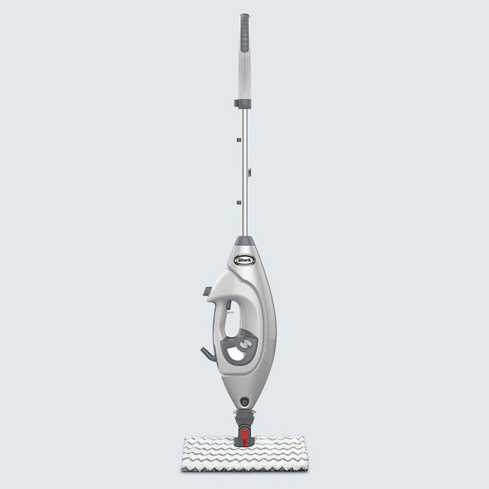Steam mop stands upright, showcasing design and features, set against a plain background.