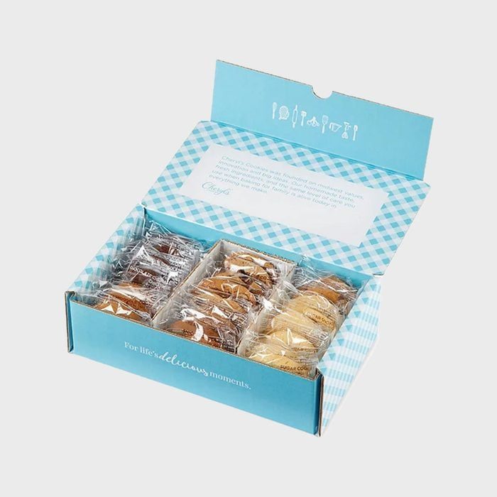 Box holds individually wrapped cookies, separated into sections, with a blue gingham interior and exterior, featuring text: 