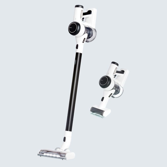 Cordless vacuum cleaner displayed vertically with attachments, set against a plain light grey background.