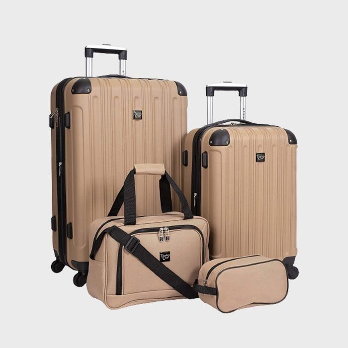 Beige luggage set displayed; two rolling suitcases and two smaller bags; neutral background.