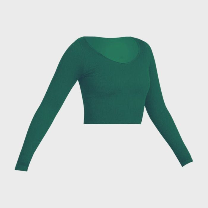 Green long-sleeve crop top displayed against a plain white background.