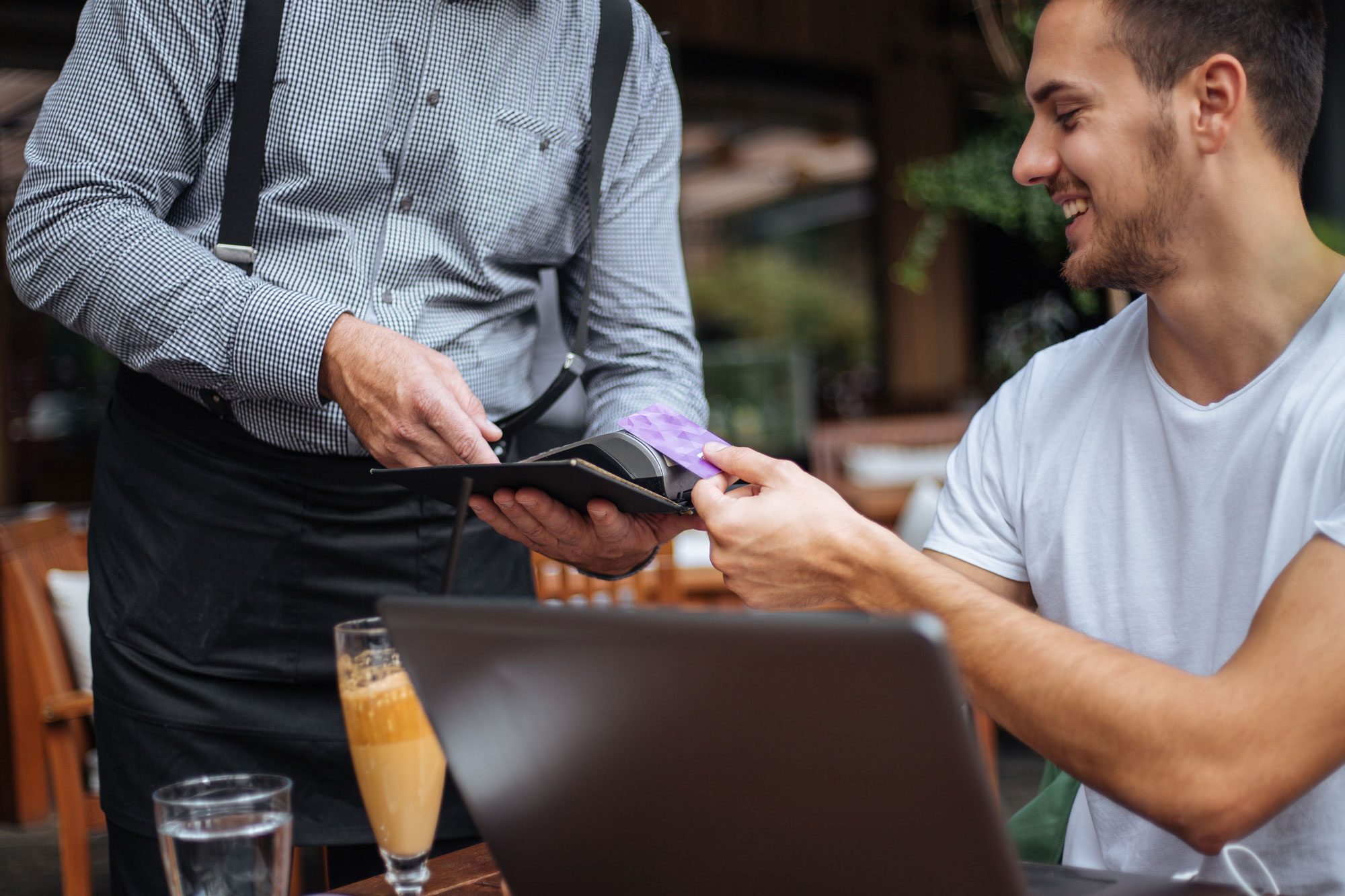 Young Man Paying With His Credit Card