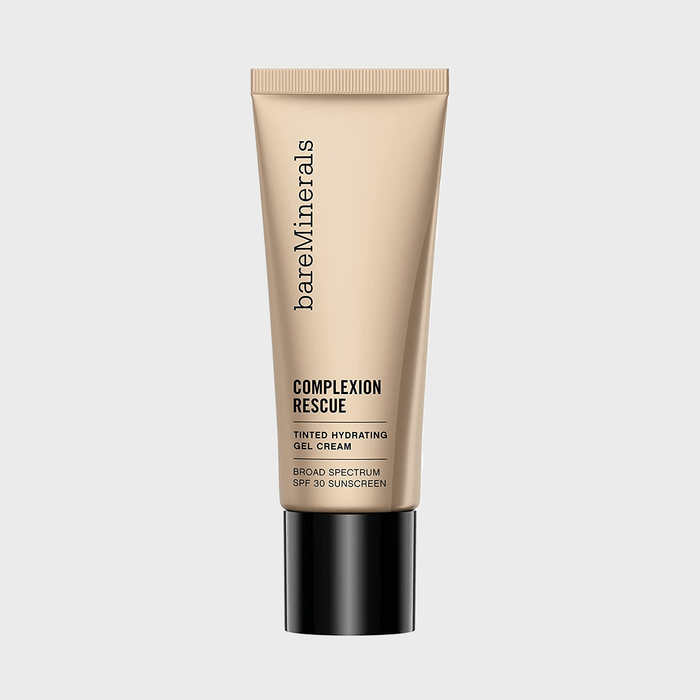 A beige tube stands upright featuring 