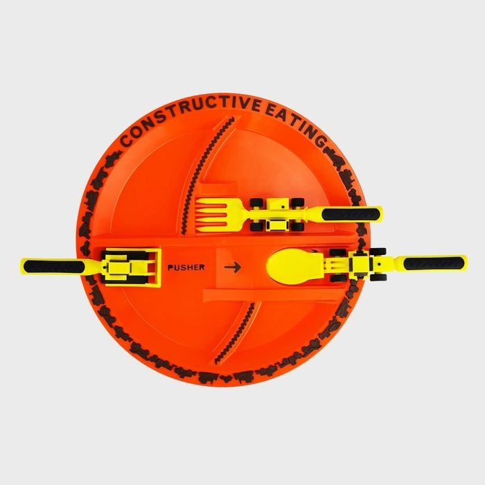 Orange plate features construction-themed utensils; fork, spoon, and pusher resemble tools. Text reads 