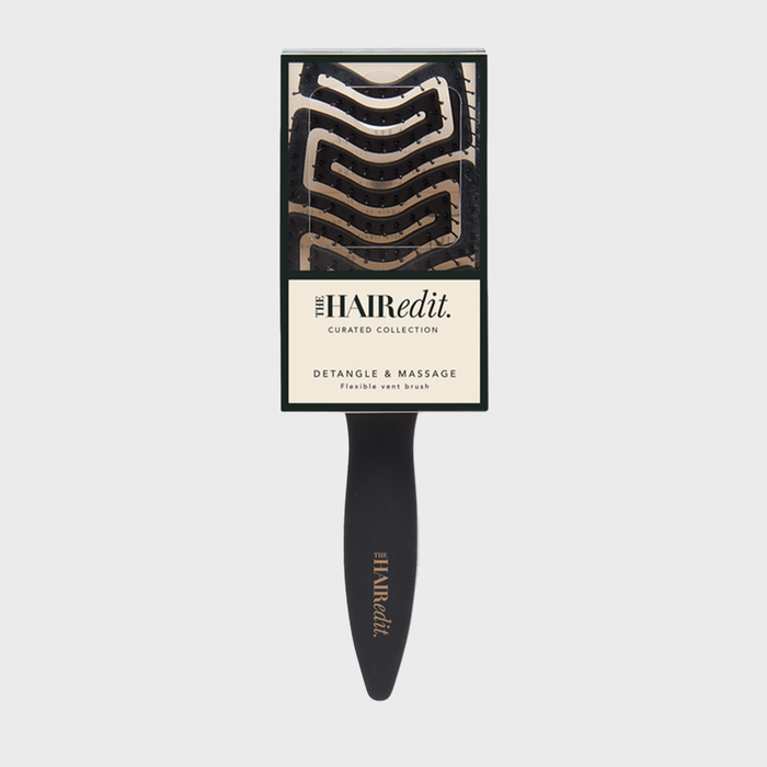 Hairbrush displayed in packaging, labeled 