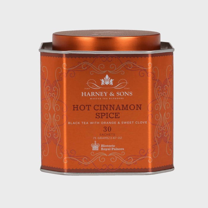 A rectangular orange tin displays 