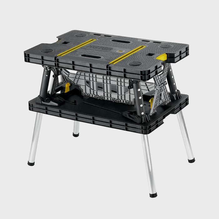 Workbench, with collapsible design, stands on metal legs against a plain background, featuring dark surface accents and yellow highlights.