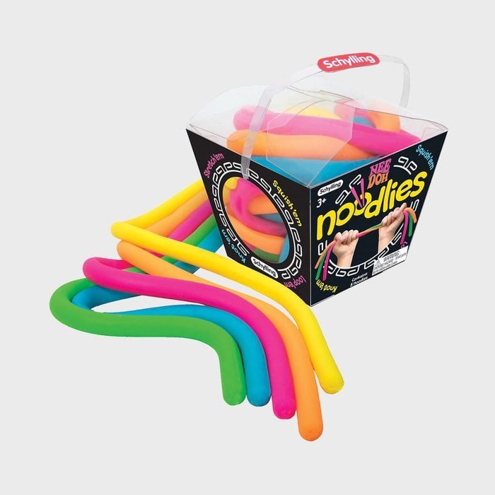 Colorful noodle toys spill from a black box with bright branding, set against a plain background.