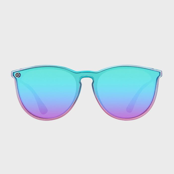 Sunglasses display a gradient design transitioning from aqua blue to pink, set against a plain white background.