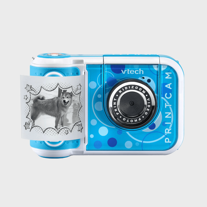 A blue camera prints a black-and-white photo of a dog, featuring playful star decorations on the image's border.