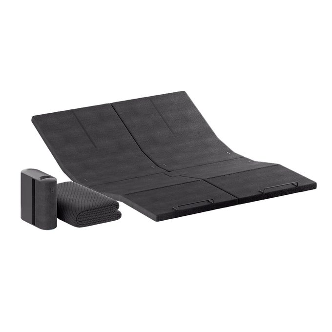 Folding mat lies flat with raised sections; next to it, a compact device and a folded textured blanket, against a plain white background.