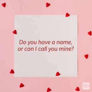 Valentine’s Day Pickup Line on paper background with scattered hearts around it background